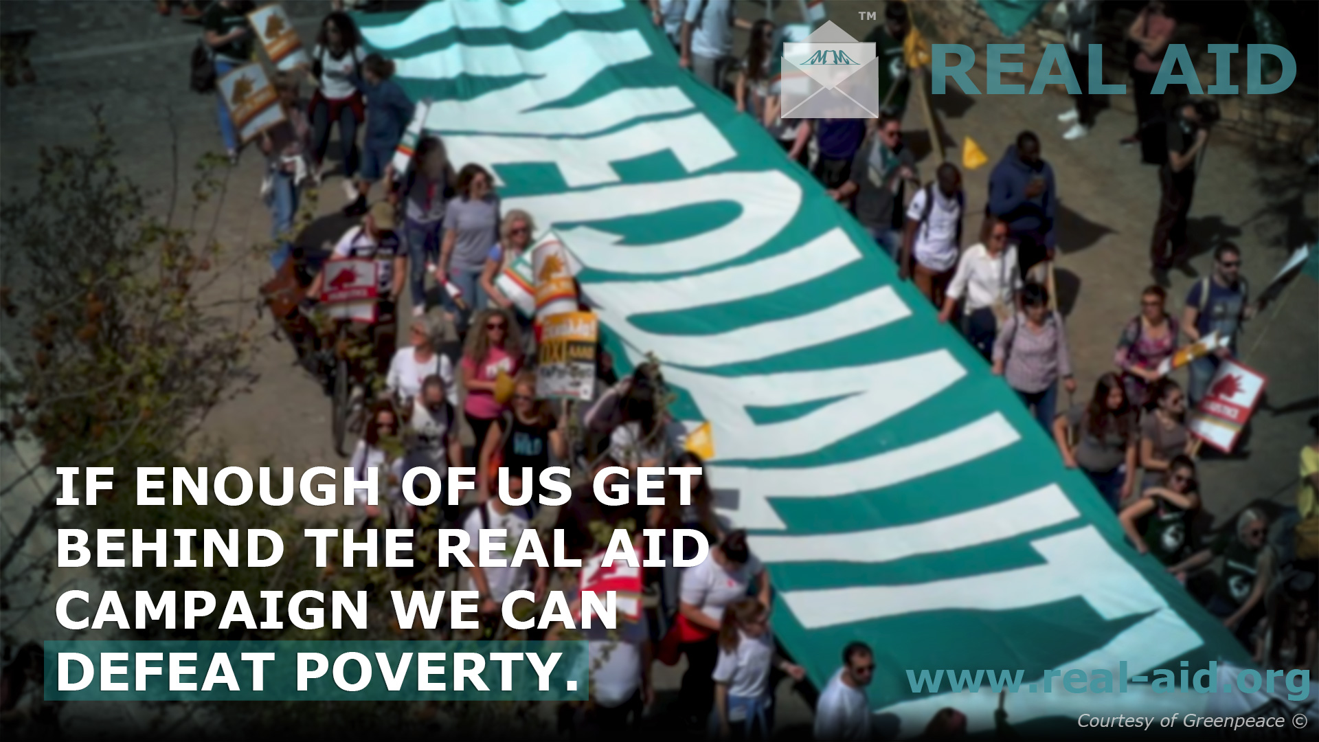 Real Aid poster, "if enough of us get behind the real aid campaign we cand efeat poverty" text, image of protestors with large banner reading inequality